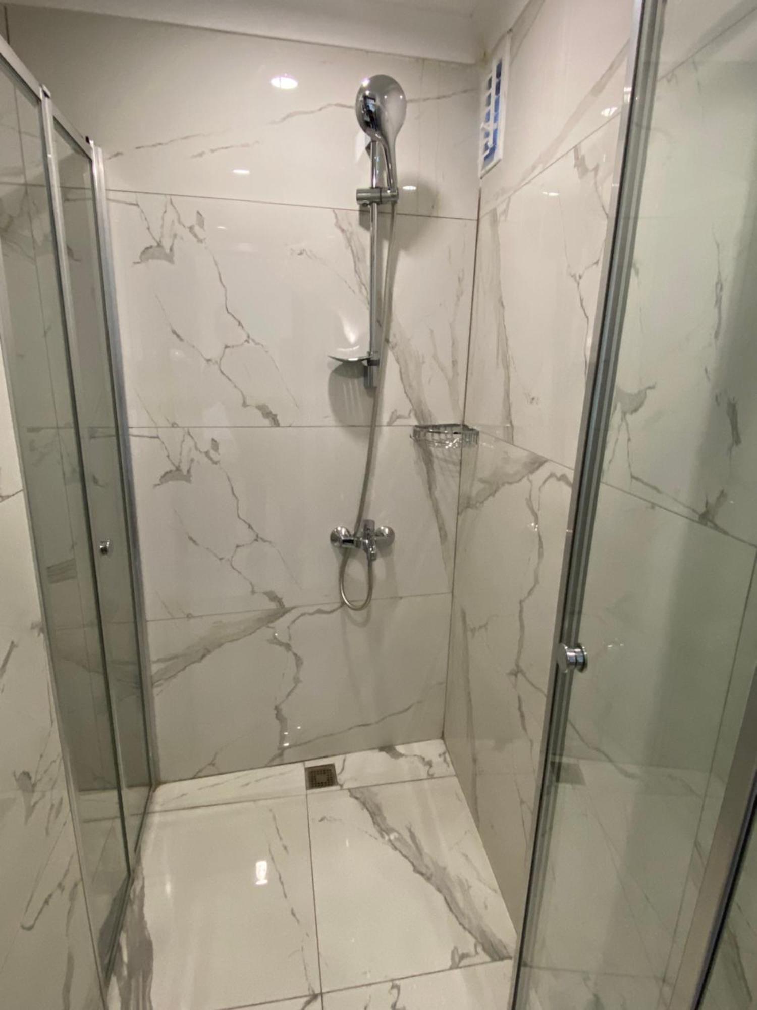 Zeyn Otel Istanbul Exterior photo A shower with a shower door